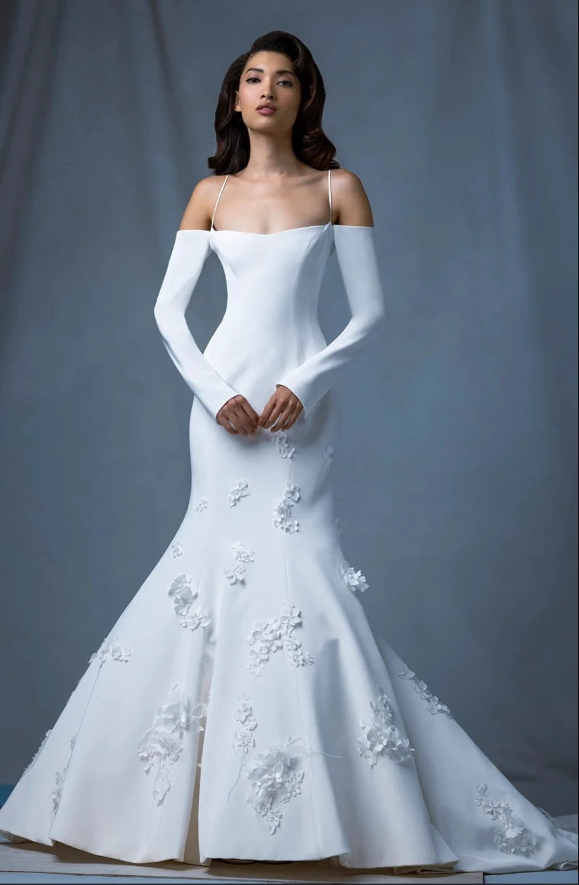 A model poses wearing the Ines Di Santo Gambrel dress in a photography studio