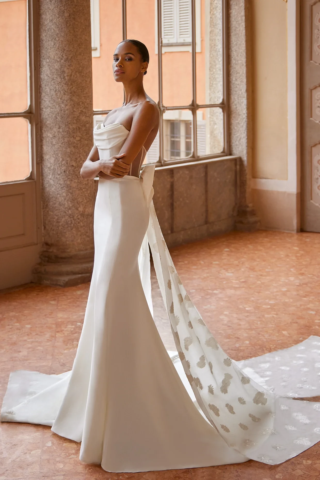 A model wears the Ines Di Santo Topaz dress in a ballroom